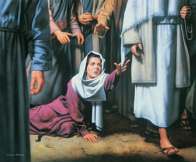 woman touching Jesus robe